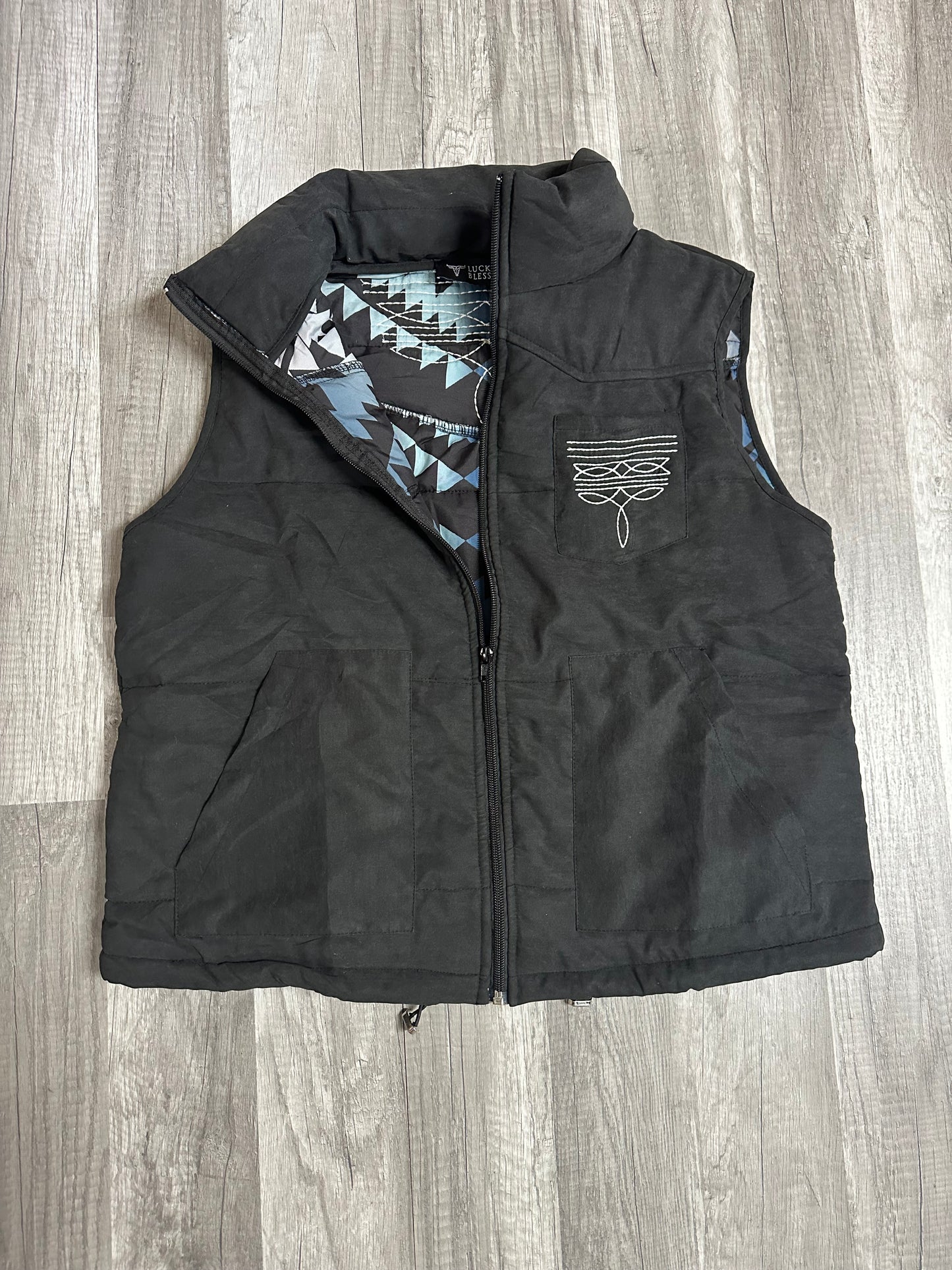 Puffer vest with Aztec lining and boot stitch detail